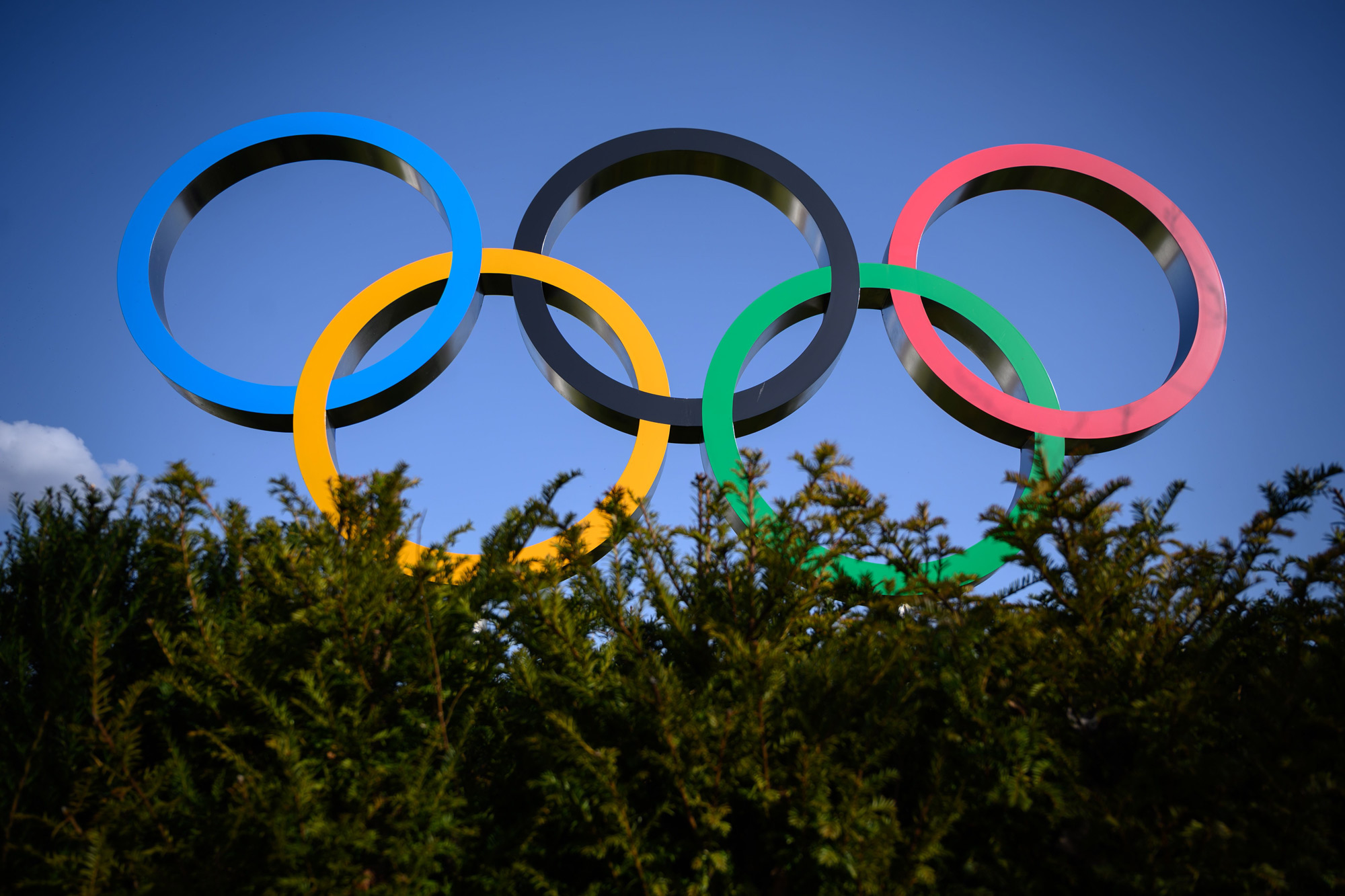 The Olympic Rings are pictured next to the headquarters of the International Olympic Committee (IOC) in Lausanne on March 21, 2020, as doubts increase over whether Tokyo can safely host the summer Games amid the spread of the COVID-19. - The global sporting calendar has been swept away by the coronavirus pandemic but the International Olympic Committee has insisted the Tokyo Games will go ahead in four months despite growing calls for a postponement. (Photo by Fabrice COFFRINI / AFP) (Photo by FABRICE COFFRINI/AFP via Getty Images)