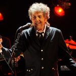 FILE - Musician Bob Dylan performs in Los Angeles on Jan. 12, 2012. Transcripts of lost 1971 Dylan interviews with the late American blues artist Tony Glover and letters the two exchanged reveal that Dylan changed his name from Robert Zimmerman because he worried about anti-Semitism, and that he wrote "Lay Lady Lay" for actress Barbra Streisand. The items are among a trove of Dylan archives being auctioned in November 2020 by Boston-based R.R. Auction. (AP Photo/Chris Pizzello, File)