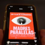 An illustration done in Madrid on August 10, 2021 shows a mobile phone displaying the poster of Spanish director Pedro Almodovar's upcoming film "Madres Paralelas" (Parallel Mothers) that was designed by Javier Jaen and was temporarily censored by Instagram for breach of its terms of use, causing controversy. - The poster features a close-up of a female nipple with a drop of breast milk that simulates a teary eye.  - RESTRICTED TO EDITORIAL USE - MANDATORY MENTION OF THE ARTIST UPON PUBLICATION - TO ILLUSTRATE THE EVENT AS SPECIFIED IN THE CAPTION (Photo by PIERRE-PHILIPPE MARCOU / AFP) / RESTRICTED TO EDITORIAL USE - MANDATORY MENTION OF THE ARTIST UPON PUBLICATION - TO ILLUSTRATE THE EVENT AS SPECIFIED IN THE CAPTION / RESTRICTED TO EDITORIAL USE - MANDATORY MENTION OF THE ARTIST UPON PUBLICATION - TO ILLUSTRATE THE EVENT AS SPECIFIED IN THE CAPTION (Photo by PIERRE-PHILIPPE MARCOU/AFP via Getty Images)