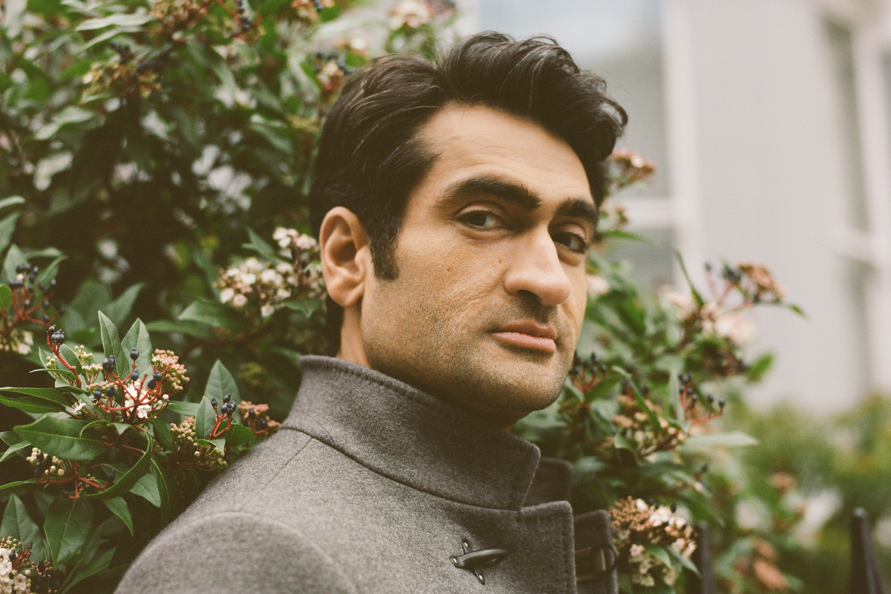 The comic and actor Kumail Nanjiani, who moved to the United States from Pakistan at 18, in London, Jan. 9, 2020. With "Little America," Nanjiani and his wife and co-creator Emily Gordon highlight immigrant narratives that buck traditional expectations focus as much on small joys and triumphs as on hardship and pain. (Ellie Smith/The New York Times)