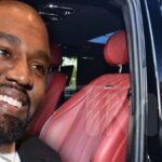 Kanye West manejando una minivan de $400k cargada con asientos giratorios de cuero y televisores