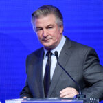 FILE - Alec Baldwin performs emcee duties at the Robert F. Kennedy Human Rights Ripple of Hope Award Gala at New York Hilton Midtown on Dec. 9, 2021, in New York. Baldwin and his family have purchased a retreat in Vermont that includes a farmhouse and about 50 acres. The Bennington Banner reports the principle broker described the property that includes a historic farmhouse built before 1800 and a guest cottage as “just gorgeous.” (Photo by Evan Agostini/Invision/AP, File)