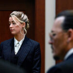 Actors Amber Heard and Johnny Depp, watch the jury arrive in the courtroom at the Fairfax County Circuit Courthouse in Fairfax, Va., Tuesday, May 17, 2022. Depp sued his ex-wife Amber Heard for libel in Fairfax County Circuit Court after she wrote an op-ed piece in The Washington Post in 2018 referring to herself as a "public figure representing domestic abuse." (Brendan Smialowski/Pool photo via AP)