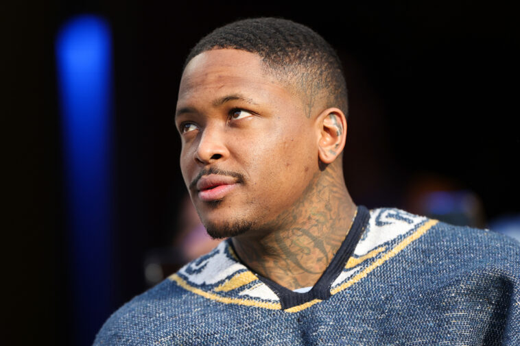 Rapper YG watches during an NFL football game between the Los Angeles Rams and the San Francisco 49ers, Sunday, Jan. 9, 2022, in Inglewood, Calif. The 49ers won 27-24 in overtime. (Ben Liebenberg via AP)