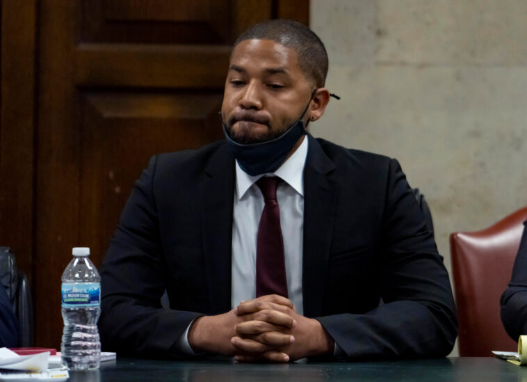 Actor Jussie Smollett listens as his sentence is read at the Leighton Criminal Court Building, Thursday, March 10, 2022, in Chicago. Jussie Smollett maintained his innocence during his sentencing hearing Thursday after a judge sentenced the former “Empire” actor to 150 days in jail for lying to police about a racist and homophobic attack that he orchestrated himself.(Brian Cassella/Chicago Tribune via AP, Pool)