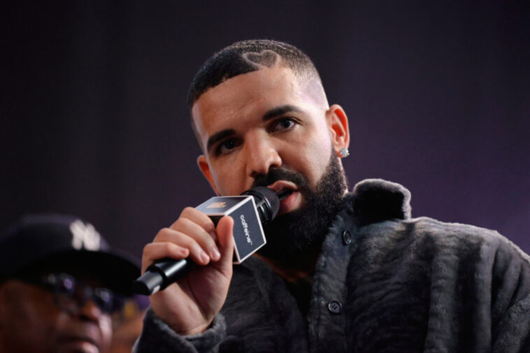 LONG BEACH, CALIFORNIA - OCTOBER 30: Drake speaks  onstage during Drake's Till Death Do Us Part rap battle on October 30, 2021 in Long Beach, California. (Photo by Amy Sussman/Getty Images)