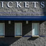 CORRECTS THAT THE LOCKOUT NOW EXTENDED TO 77 DAYS, NOT 76 AS ORIGINALLY SENT - Ticket windows remain closed on the day pitchers and catcher were scheduled to report to camp at the New York Yankees spring training complex at George M. Steinbrenner Field Wednesday, Feb. 16, 2022, in Tampa, Fla. The usual spring training buzz is missing because of a lockout that’s now extended to 77 days and become the second-longest work stoppage in baseball history. (AP Photo/Steve Nesius)