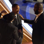 Sean Combs, from left, Will Smith and Tyler Perry appear in the audience at the Oscars on Sunday, March 27, 2022, at the Dolby Theatre in Los Angeles. (AP Photo/Chris Pizzello)