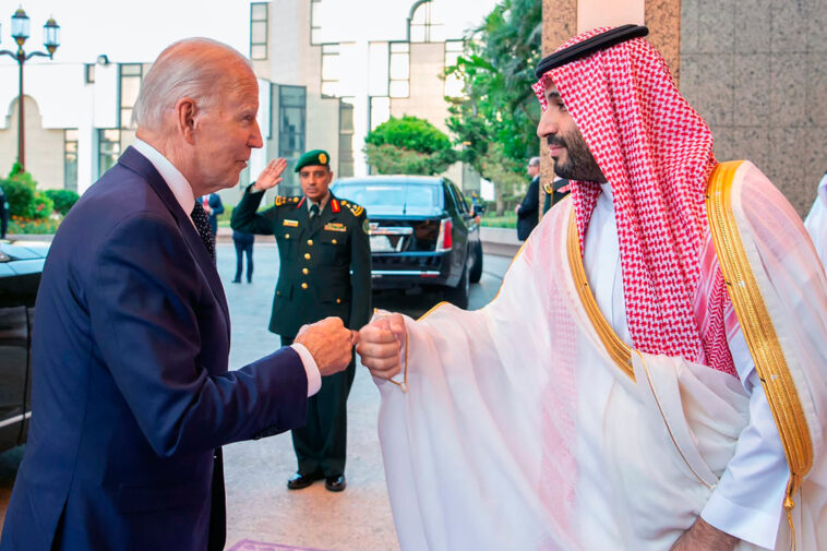 In this photo released by Saudi Press Agency (SPA), Saudi Crown Prince Mohammed bin Salman, right, greets President Joe Biden, with a fist bump after his arrival in Jeddah, Saudi Arabia, Friday, July 15, 2022. (Saudi Press Agency via AP)