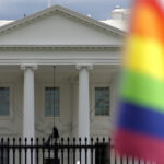 WASHINGTON, DC - JULY 04:  A rainbow flag is seen outside the White House on Independence Day on July 4, 2021 in Washington, DC. President Joe Biden and First Lady Dr. Jill Biden will host about 1,000 guests, including COVID response essential workers and military families, to celebrate the nations 245th birthday. (Photo by Alex Wong/Getty Images)