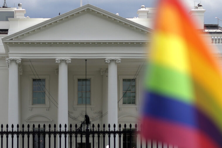 WASHINGTON, DC - JULY 04:  A rainbow flag is seen outside the White House on Independence Day on July 4, 2021 in Washington, DC. President Joe Biden and First Lady Dr. Jill Biden will host about 1,000 guests, including COVID response essential workers and military families, to celebrate the nations 245th birthday. (Photo by Alex Wong/Getty Images)