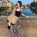 Hermosa: Louisa Lytton llamó la atención con una falda maxi multicolor y un top negro en una gran cantidad de instantáneas publicadas en Instagram el jueves desde su luna de miel italiana con Ben Bhavna.