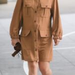 Con estilo: la embarazada Mollie King, de 35 años, mostró su creciente barriga con un elegante vestido de safari cuando llegó a los estudios de Radio 1 en Londres el domingo.