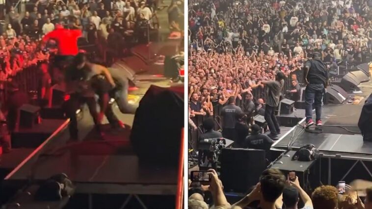 Tom Morello de Rage Against The Machine es abordado durante un concierto en Toronto