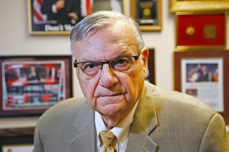 FILE - In this Aug. 26, 2019, file photo, former Maricopa County Sheriff Joe Arpaio poses for a portrait at his private office in Fountain Hills, Arizona. Taxpayers in metro Phoenix are paying one of the last major legal bills for his headline-grabbing tactics that inspired thousands of lawsuits during his six terms in office. Maricopa County paid $100 million in attorney fees, settlements and other costs in Arpaio-era lawsuits. Separately, taxpayers have shelled out another $178 million in a 2007 racial profiling case stemming from Arpaio's traffic patrols that targeted immigrants, though much of spending occurred during his successor's watch. (AP Photo/Ross D. Franklin, File)