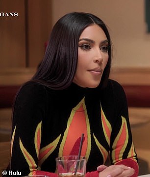 Luciendo bien: durante la conversación, las hermanas se veían tan glamorosas como siempre con Kim luciendo un vestido bordado con llamas mientras que Khloe lucía un cuello alto negro mientras cenaban juntas.