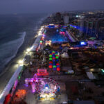 This aerial view shows the Baja Beach Fest music festival in Playas de Rosarito, Baja Caifornia, Mexico August 21, 2021, amid the coronavirus pandemic. (Photo by Guillermo Arias / AFP) (Photo by GUILLERMO ARIAS/AFP via Getty Images)