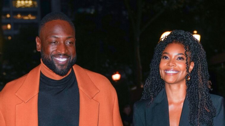 Gabrielle Union hace ropa de hombre mejor que su esposo en traje negro sin camisa